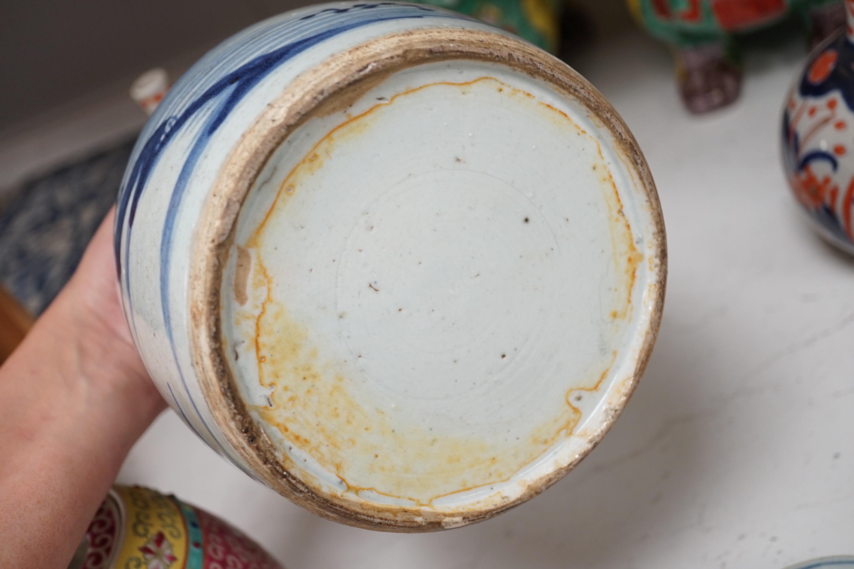 A collection of 20th century Chinese and Japanese ceramics including pair of Imari bottle neck vases, blue and white jar and cover and a pair of dog of foo pots and covers (one cover missing) together with two cloisonné